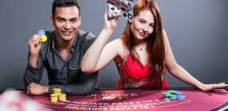 slot raja mobile app showing split-screen: NBA live score feed on top, live baccarat table below